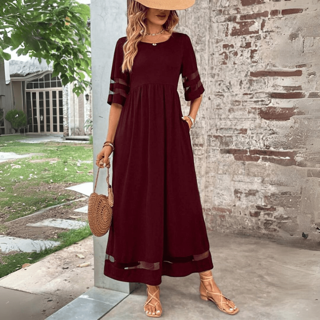 Tummy-smoothing midi dress featuring an empire waist and flowing skirt, designed for women with long sleeves in a classic white color. 4