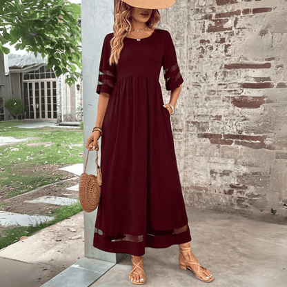 Tummy-smoothing midi dress featuring an empire waist and flowing skirt, designed for women with long sleeves in a classic white color. 4