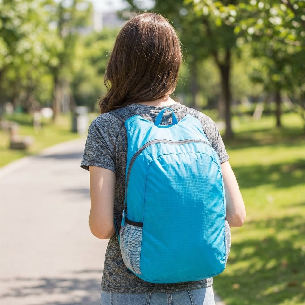 Ultralight travel backpack featuring water-resistant fabric, durable YKK zipper, and a compact foldable design, available in multiple colors. 1
