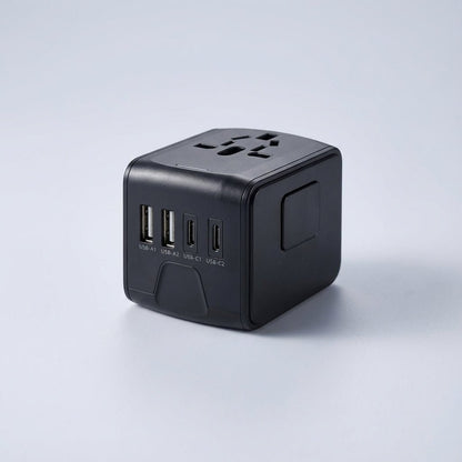 Universal travel adapter featuring dual USB ports and an AC socket, designed for global use, compact size ideal for charging multiple devices while traveling. 0