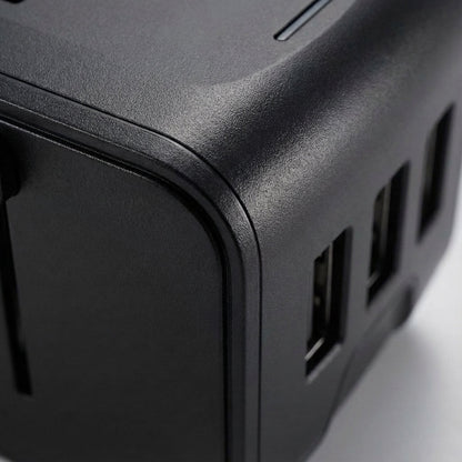 Universal travel adapter featuring dual USB ports and an AC socket, designed for global use, compact size ideal for charging multiple devices while traveling. 3