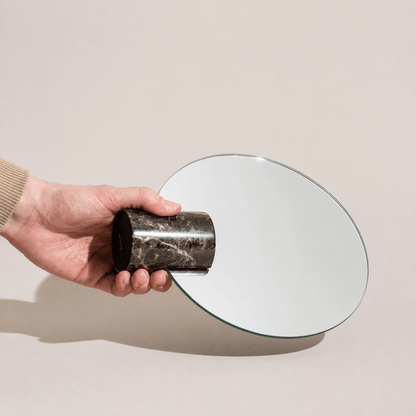 Vanity mirror with a frameless design and natural marble base, showcasing an elegant freestanding accent for modern home decor. 2