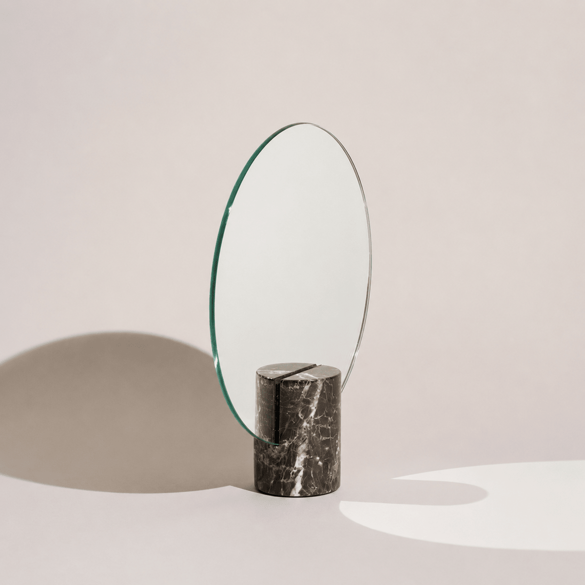 Vanity mirror with a frameless design and natural marble base, showcasing an elegant freestanding accent for modern home decor. 3