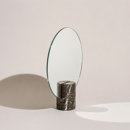 Vanity mirror with a frameless design and natural marble base, showcasing an elegant freestanding accent for modern home decor. 3