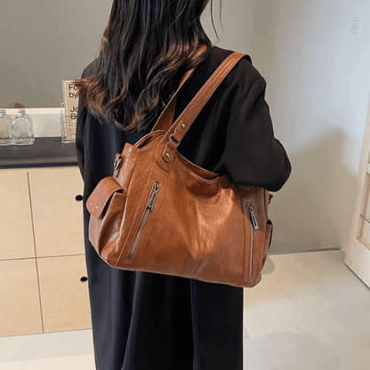 Vegan leather shoulder bag for women featuring a spacious interior and elegant metal accents, perfect for stylish and versatile everyday use. 3