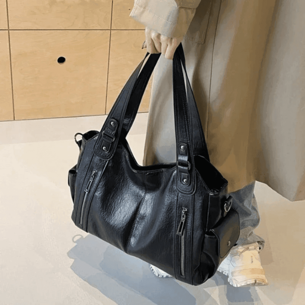 Vegan leather shoulder bag for women featuring a spacious interior and elegant metal accents, perfect for stylish and versatile everyday use. 6