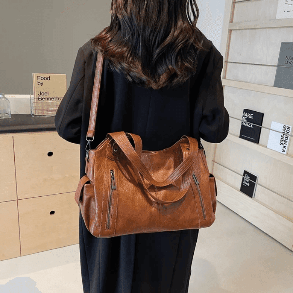Vegan leather shoulder bag for women featuring a spacious interior and elegant metal accents, perfect for stylish and versatile everyday use. 4