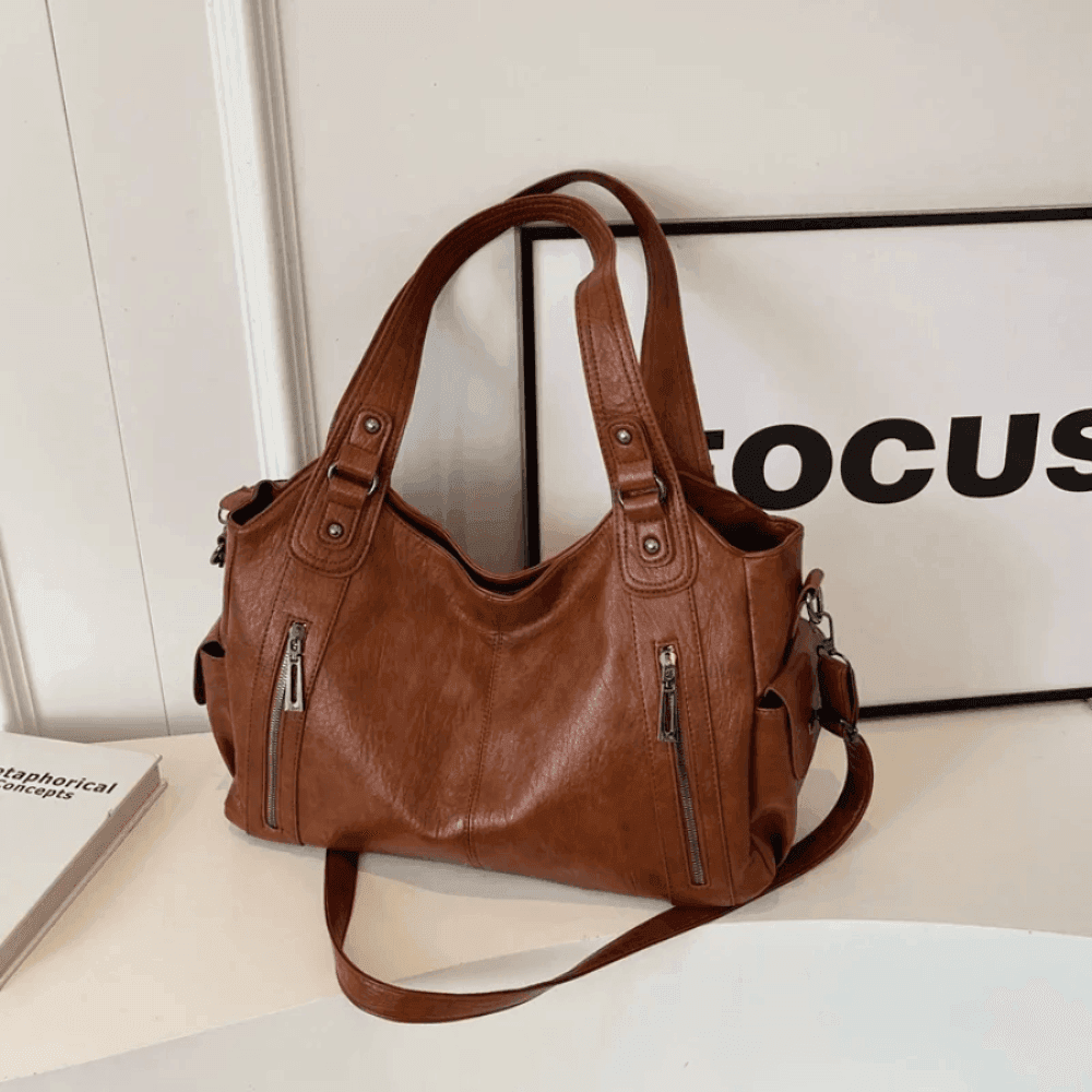 Vegan leather shoulder bag for women featuring a spacious interior and elegant metal accents, perfect for stylish and versatile everyday use. 5