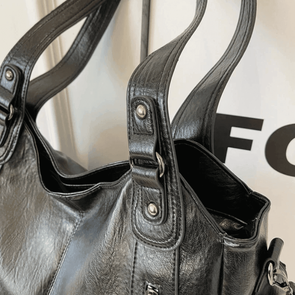Vegan leather shoulder bag for women featuring a spacious interior and elegant metal accents, perfect for stylish and versatile everyday use. 8