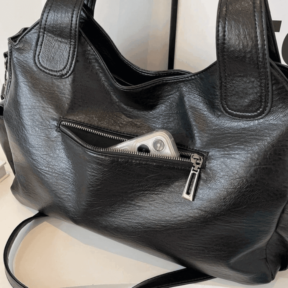 Vegan leather shoulder bag for women featuring a spacious interior and elegant metal accents, perfect for stylish and versatile everyday use. 7