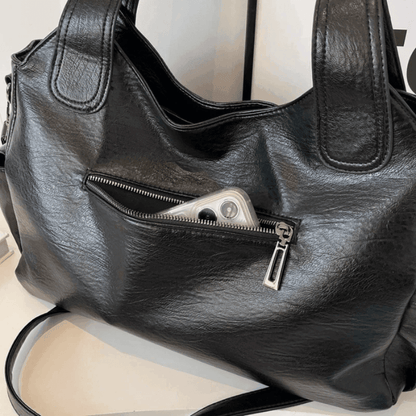 Vegan leather shoulder bag for women featuring a spacious interior and elegant metal accents, perfect for stylish and versatile everyday use. 7