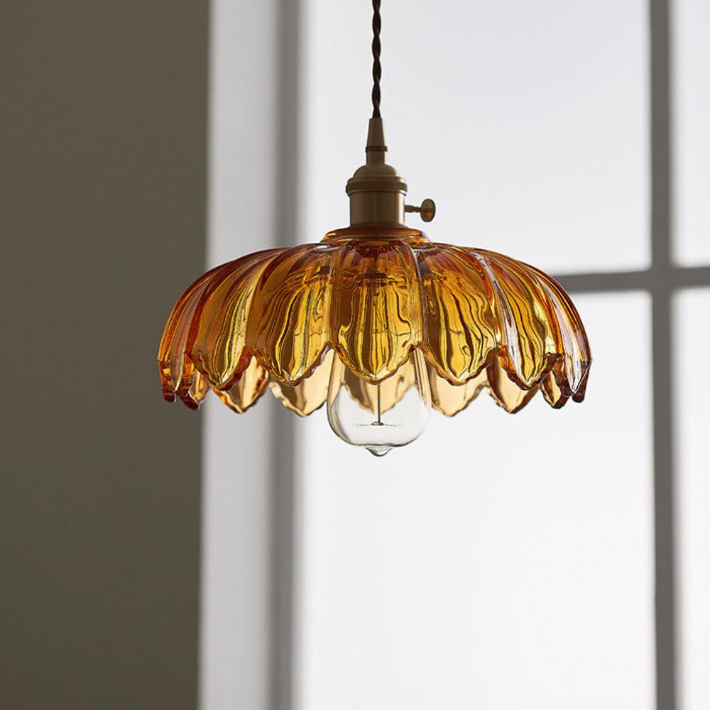 Vintage glass pendant light with a stylish copper finish, designed to provide soft ambient illumination for kitchen islands, enhancing rustic and modern decor. 6