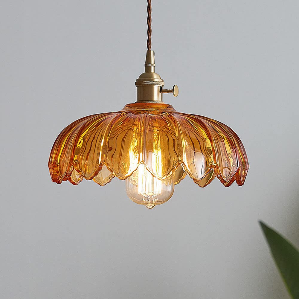 Vintage glass pendant light with a stylish copper finish, designed to provide soft ambient illumination for kitchen islands, enhancing rustic and modern decor. 3