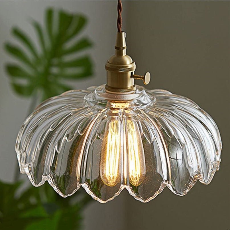 Vintage glass pendant light with a stylish copper finish, designed to provide soft ambient illumination for kitchen islands, enhancing rustic and modern decor. 8