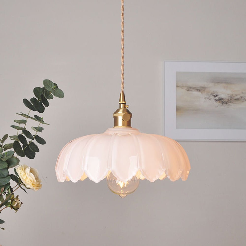 Vintage glass pendant light with a stylish copper finish, designed to provide soft ambient illumination for kitchen islands, enhancing rustic and modern decor. 9