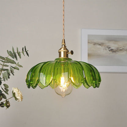 Vintage glass pendant light with a stylish copper finish, designed to provide soft ambient illumination for kitchen islands, enhancing rustic and modern decor. 1