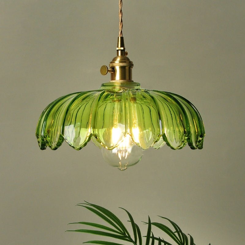 Vintage glass pendant light with a stylish copper finish, designed to provide soft ambient illumination for kitchen islands, enhancing rustic and modern decor. 10