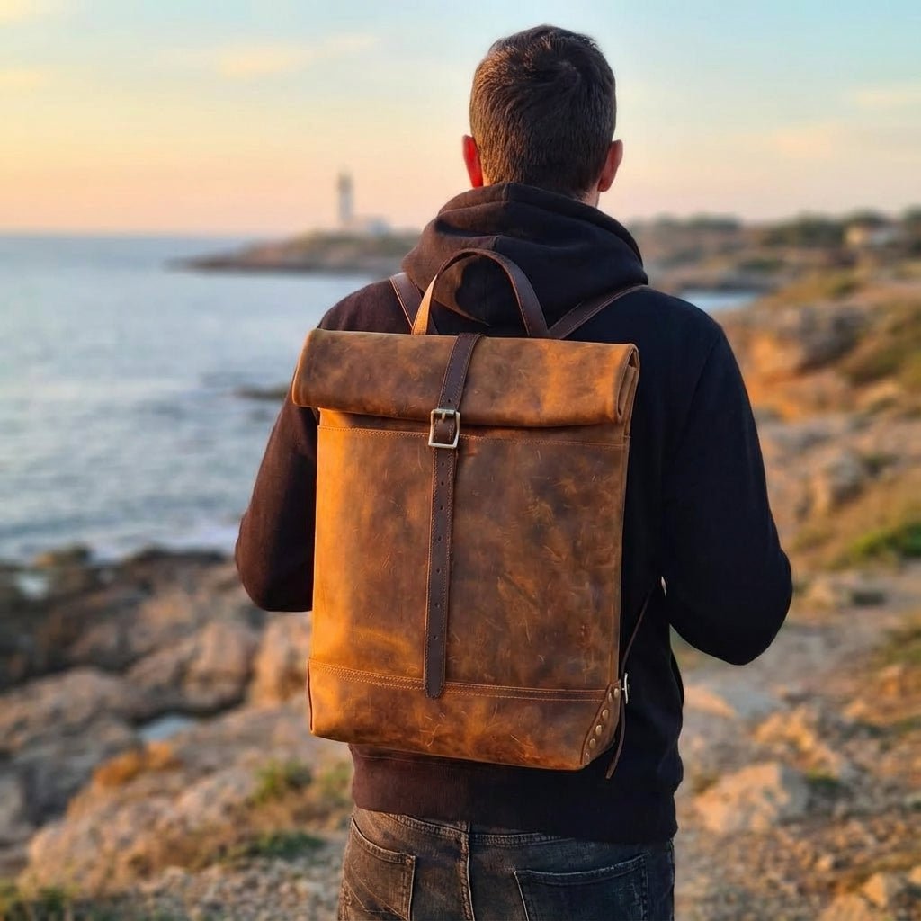 Vintage leather backpack featuring a spacious design, sturdy brass hardware, and a timeless aesthetic perfect for travel and everyday use. 0