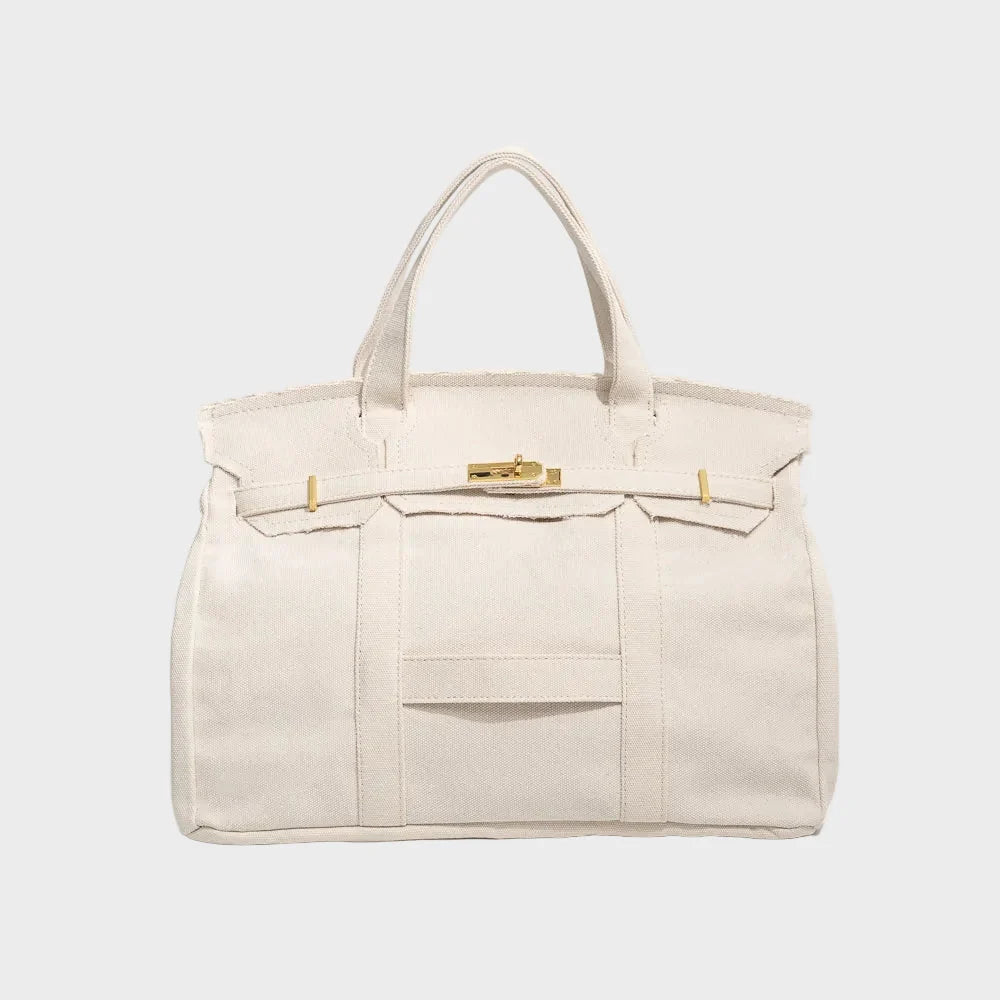 Vintage linen canvas tote bag featuring reinforced handles and a secure snap closure, perfect for stylish and eco-friendly shopping or daily use. 5