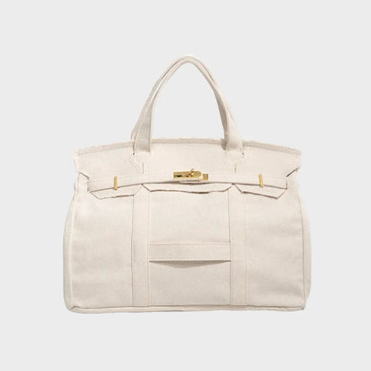 Vintage linen canvas tote bag featuring reinforced handles and a secure snap closure, perfect for stylish and eco-friendly shopping or daily use. 5
