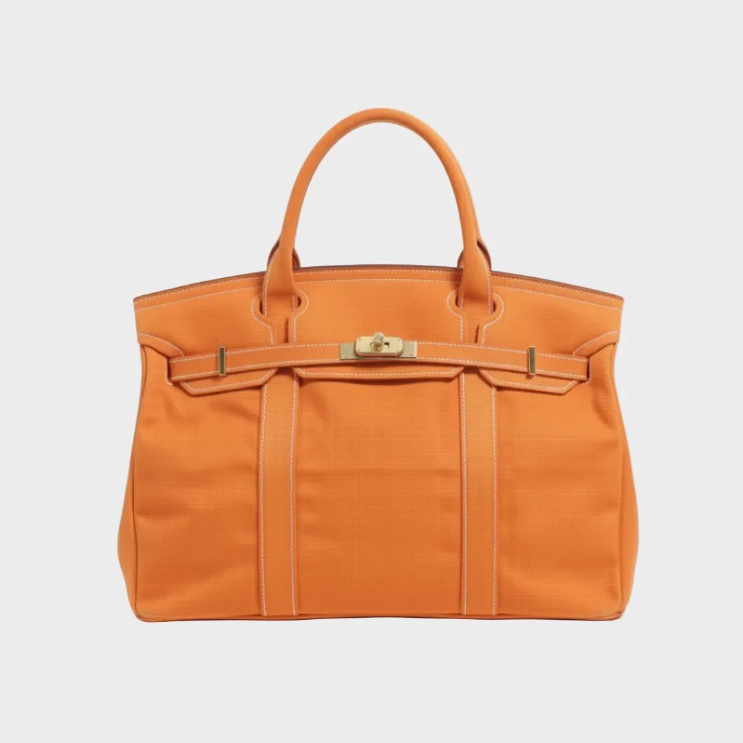 Vintage linen canvas tote bag featuring reinforced handles and a secure snap closure, perfect for stylish and eco-friendly shopping or daily use. 11