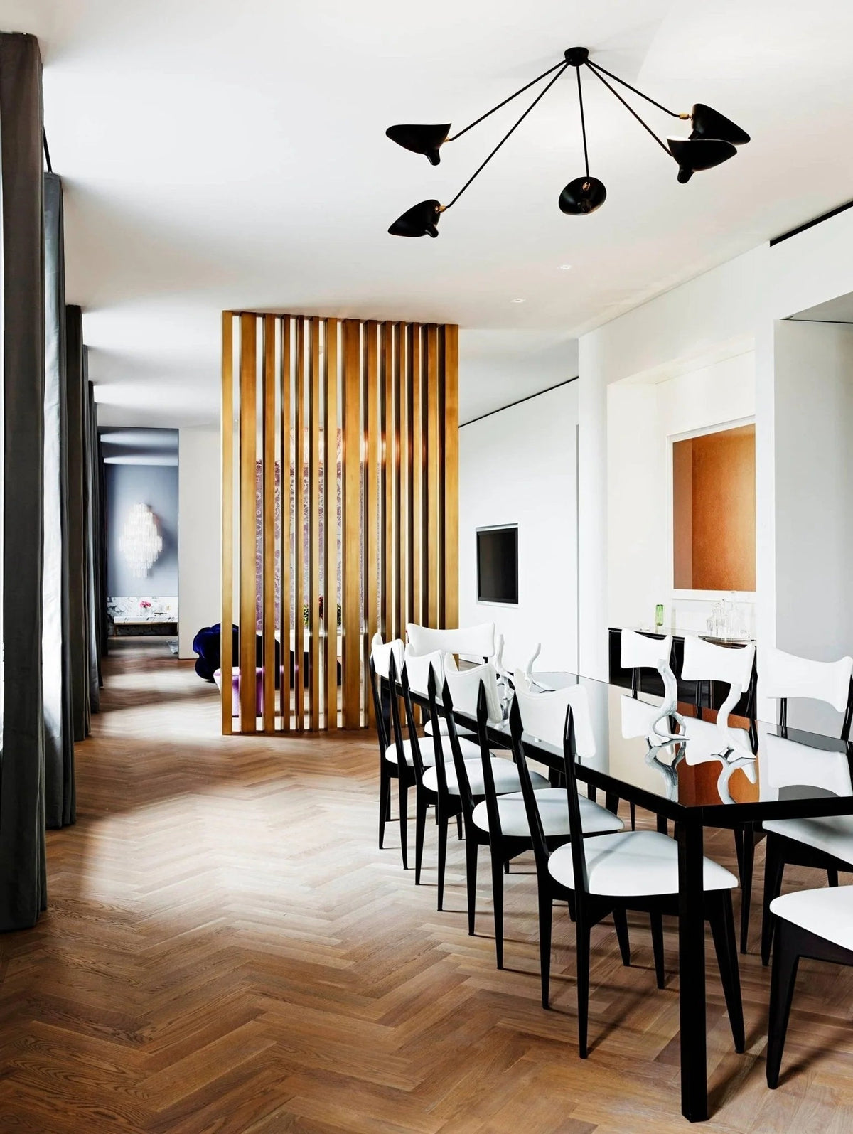 Vintage pendant light featuring 3 or 5 lights, designed with lacquered black metal arms and elegant brass accents, ideal for adding a stylish touch to 8