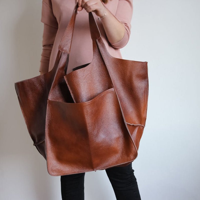 Vintage leather tote bag, featuring an elegant design and durable construction, perfect for everyday use with a spacious interior for all your essentials. 11