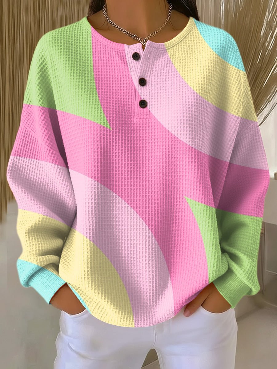 Waffle knit henley sweater featuring an oversized fit and geometric color blocking design, crafted from cozy double-layer fabric for warmth and comfort. 0