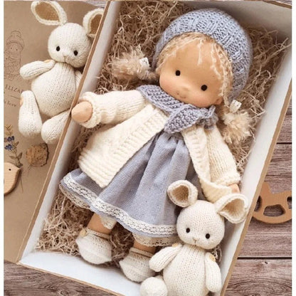 Waldorf-style cotton cuddly toy in a fabric box, featuring a soft plush doll designed for creative play and imaginative adventures. 0