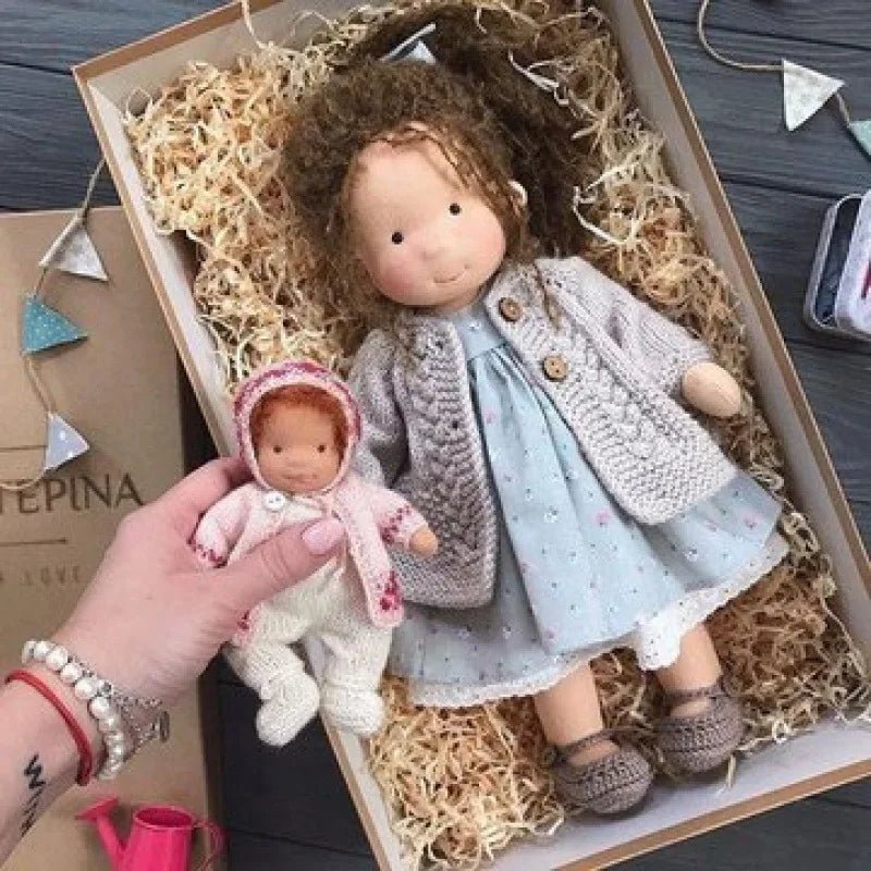 Waldorf-style cotton cuddly toy in a fabric box, featuring a soft plush doll designed for creative play and imaginative adventures. 22