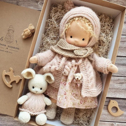 Waldorf-style cotton cuddly toy in a fabric box, featuring a soft plush doll designed for creative play and imaginative adventures. 12