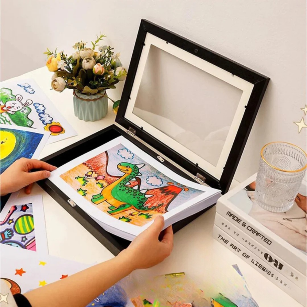 Modern wall-mounted display frame for kids' drawings featuring integrated storage, perfect for showcasing and organizing children's artwork. 1