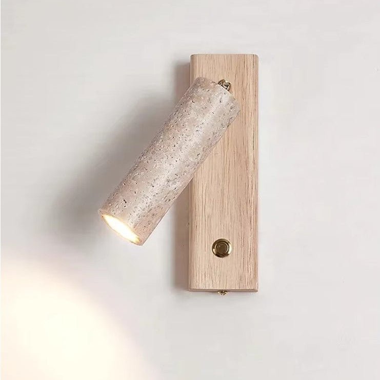 Wall lamp featuring an adjustable spotlight and crafted from natural travertine, showcasing a warm minimalist design ideal for modern interiors. 1