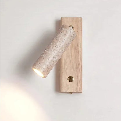 Wall lamp featuring an adjustable spotlight and crafted from natural travertine, showcasing a warm minimalist design ideal for modern interiors. 1