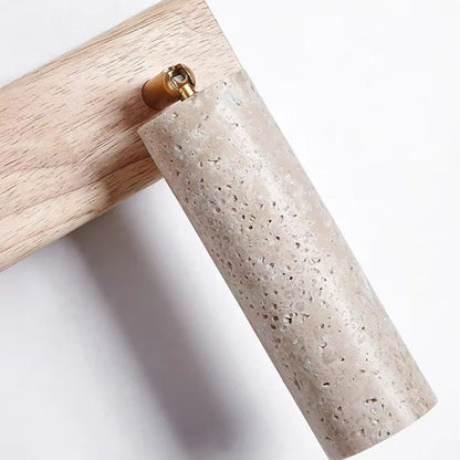 Wall lamp featuring an adjustable spotlight and crafted from natural travertine, showcasing a warm minimalist design ideal for modern interiors. 3