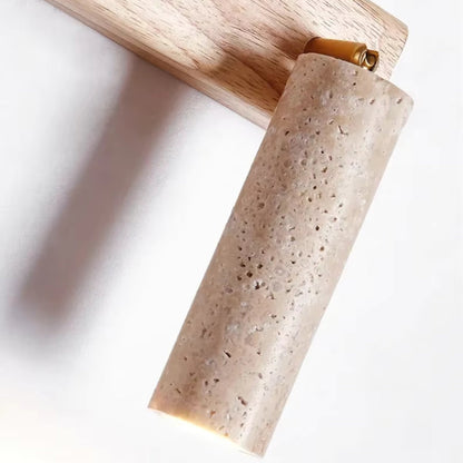 Wall lamp featuring an adjustable spotlight and crafted from natural travertine, showcasing a warm minimalist design ideal for modern interiors. 5