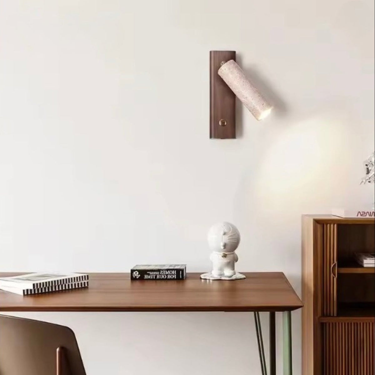 Wall lamp featuring an adjustable spotlight and crafted from natural travertine, showcasing a warm minimalist design ideal for modern interiors. 2