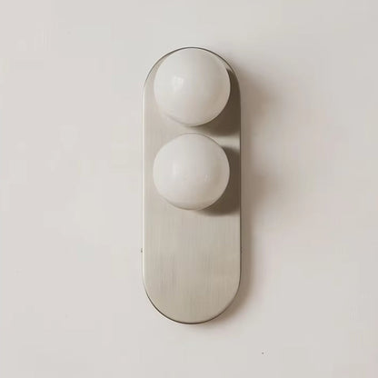 Modern vertical wall sconce featuring frosted glass globes and a sleek brushed nickel finish, perfect for contemporary home decor. 2