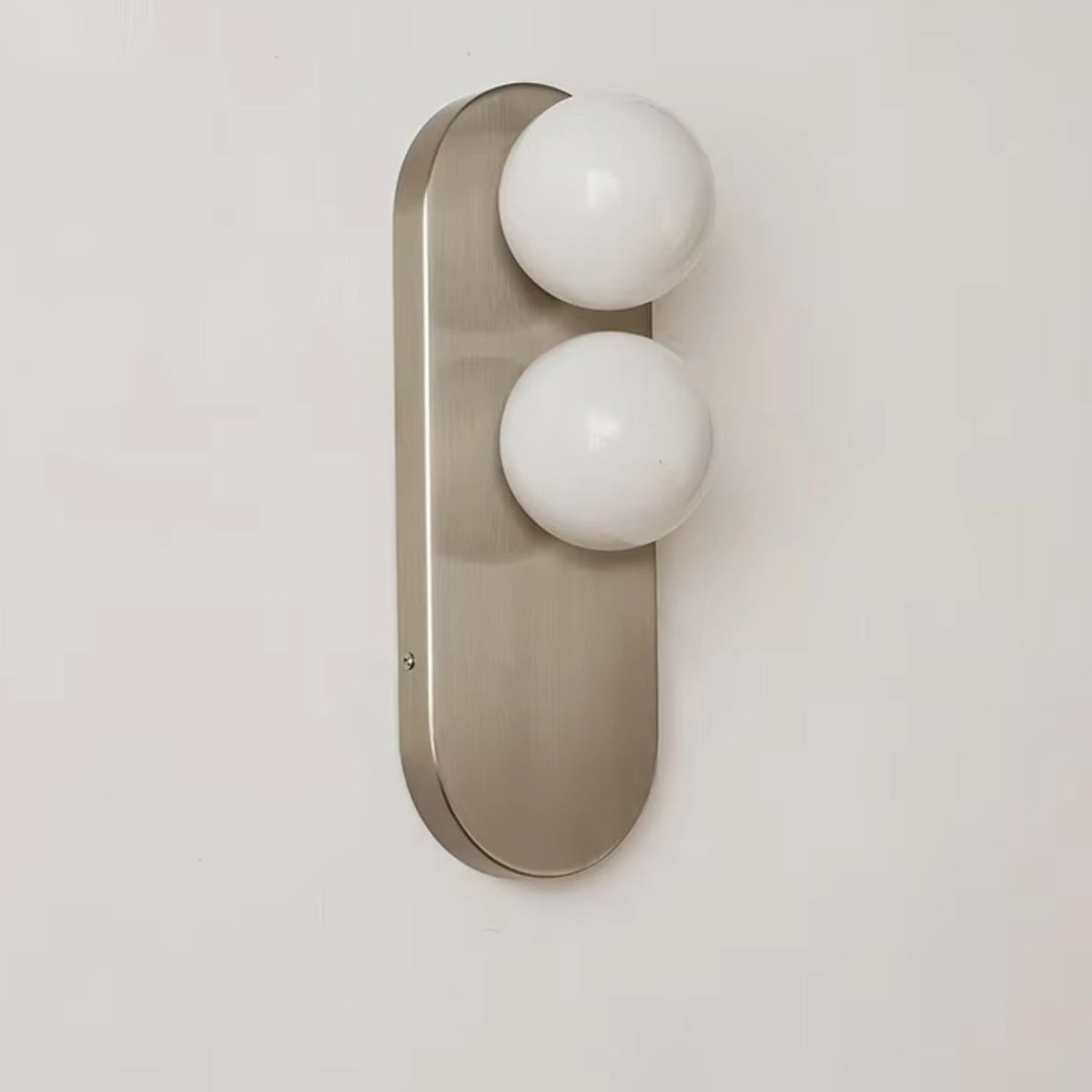 Modern vertical wall sconce featuring frosted glass globes and a sleek brushed nickel finish, perfect for contemporary home decor. 0