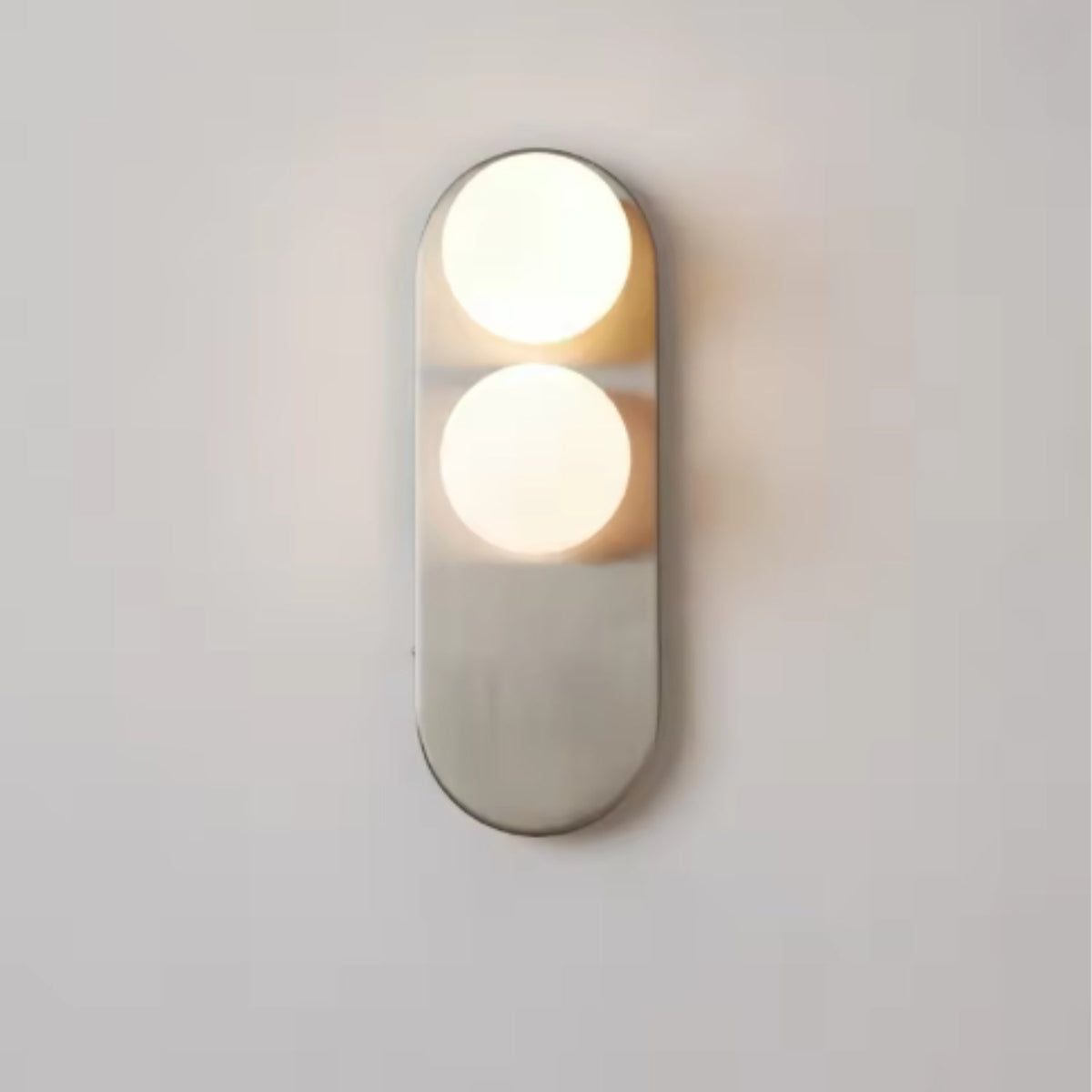 Modern vertical wall sconce featuring frosted glass globes and a sleek brushed nickel finish, perfect for contemporary home decor. 3