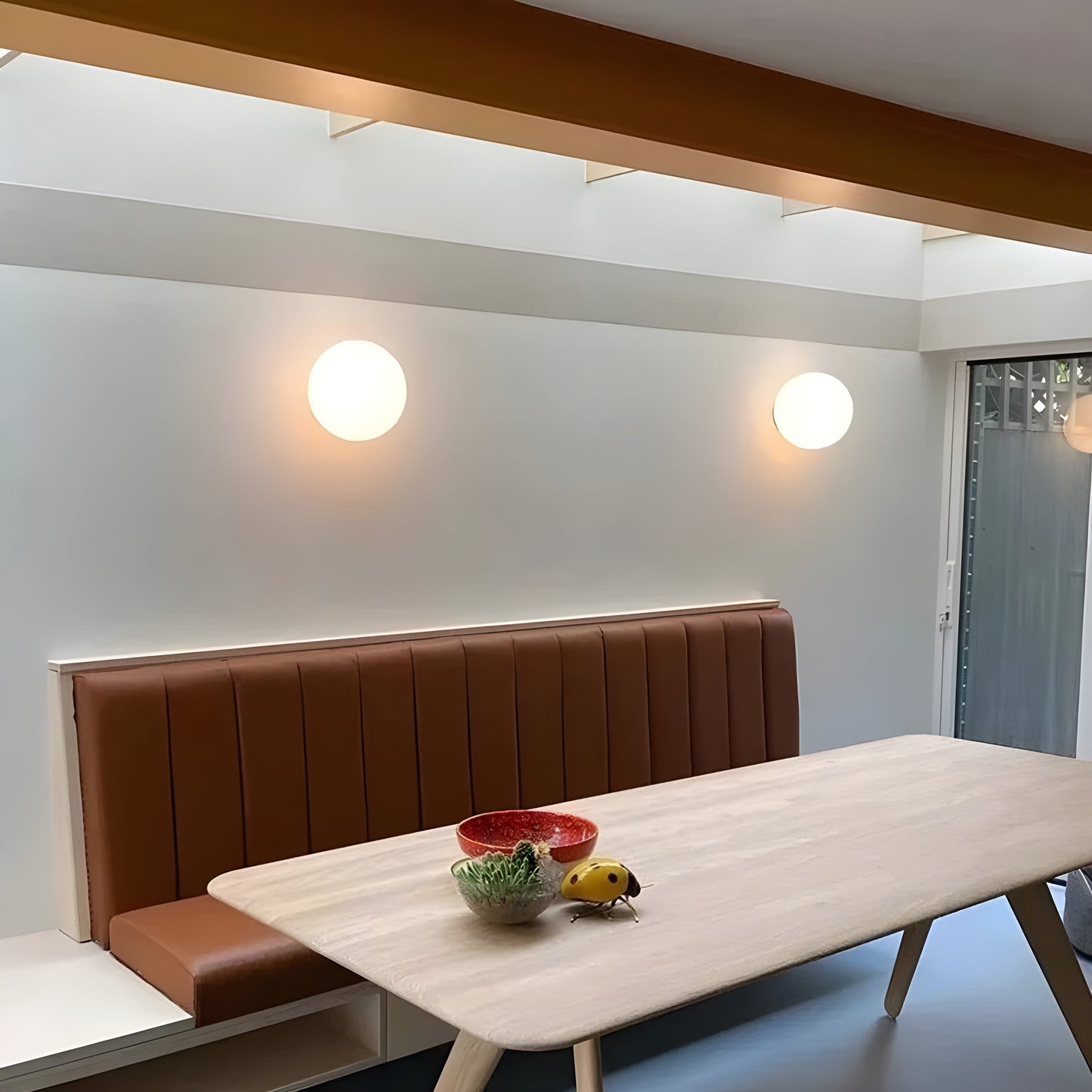 Modern minimalist wall lamp featuring a frosted glass shade for soft light distribution, ideal for enhancing contemporary interiors. 2