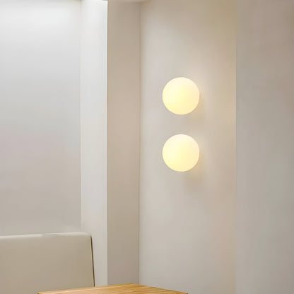 Modern minimalist wall lamp featuring a frosted glass shade for soft light distribution, ideal for enhancing contemporary interiors. 0