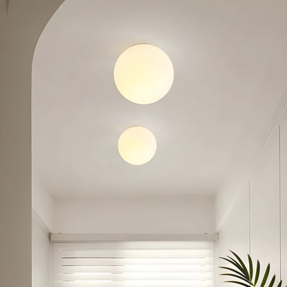 Modern minimalist wall lamp featuring a frosted glass shade for soft light distribution, ideal for enhancing contemporary interiors. 4