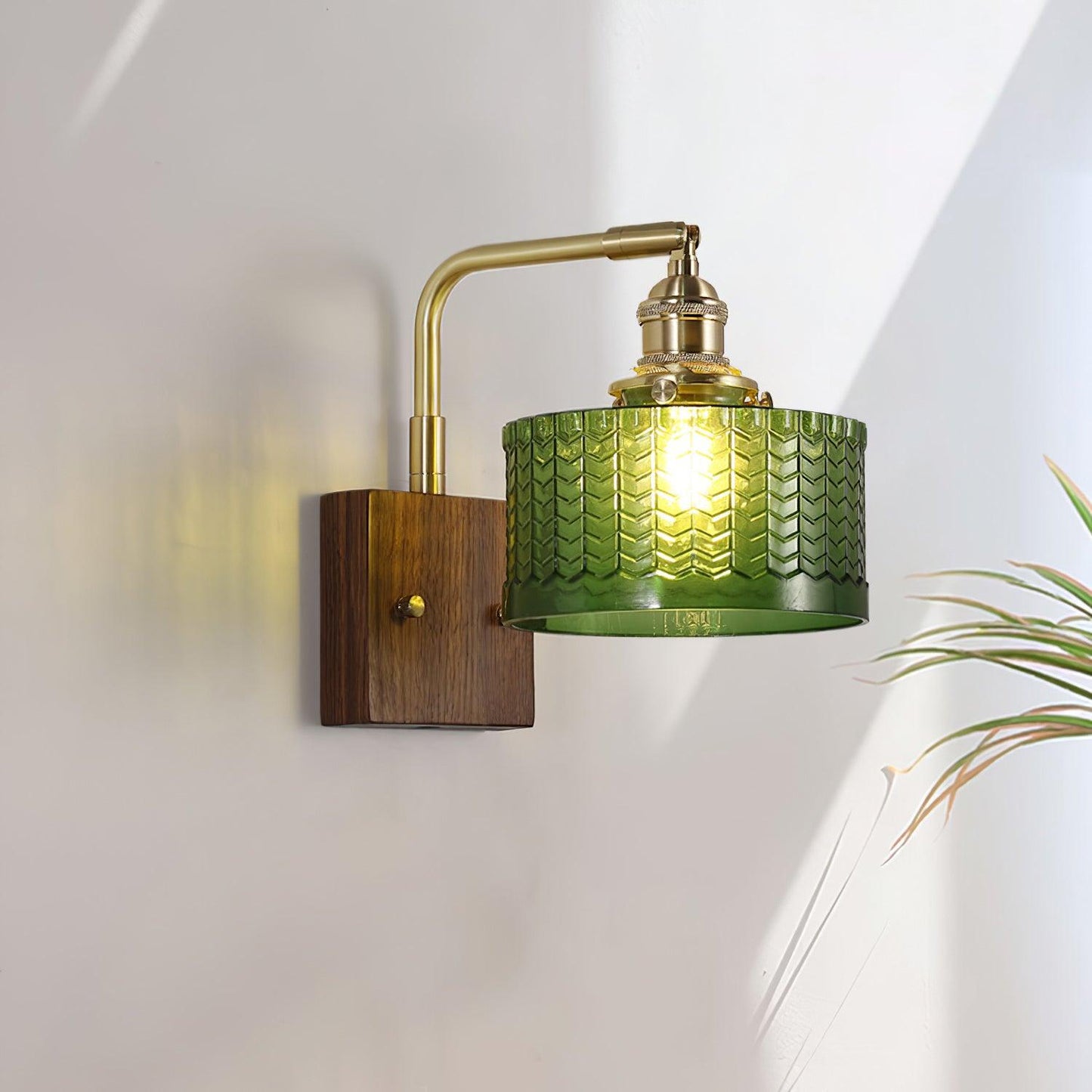 Wall lamp featuring a green motif glass shade and a stylish wooden base, perfect for adding atmospheric lighting to any room. 0