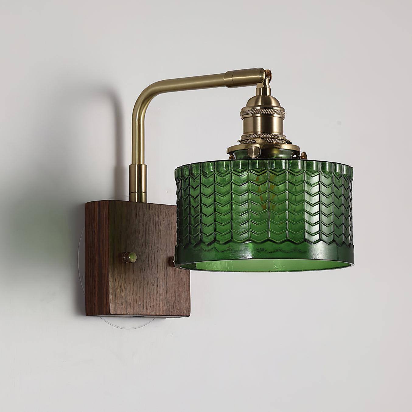 Wall lamp featuring a green motif glass shade and a stylish wooden base, perfect for adding atmospheric lighting to any room. 1