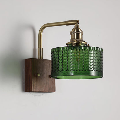 Wall lamp featuring a green motif glass shade and a stylish wooden base, perfect for adding atmospheric lighting to any room. 1