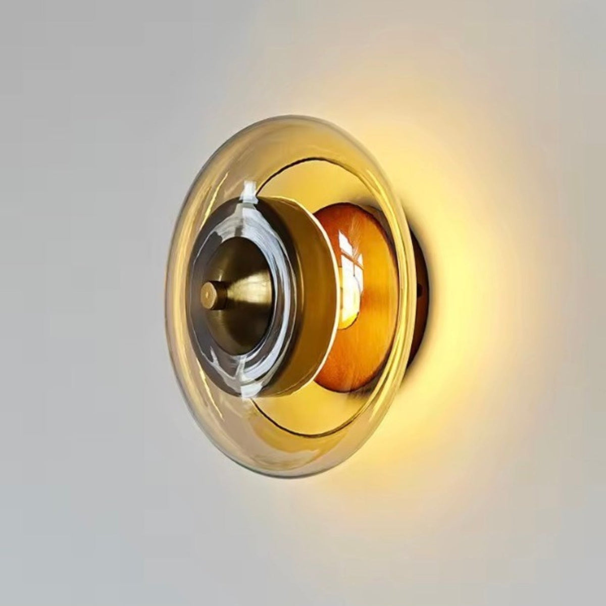 Wall lamp featuring integrated LED technology and elegant amber glass, designed for compact decorative lighting in modern interiors. 1