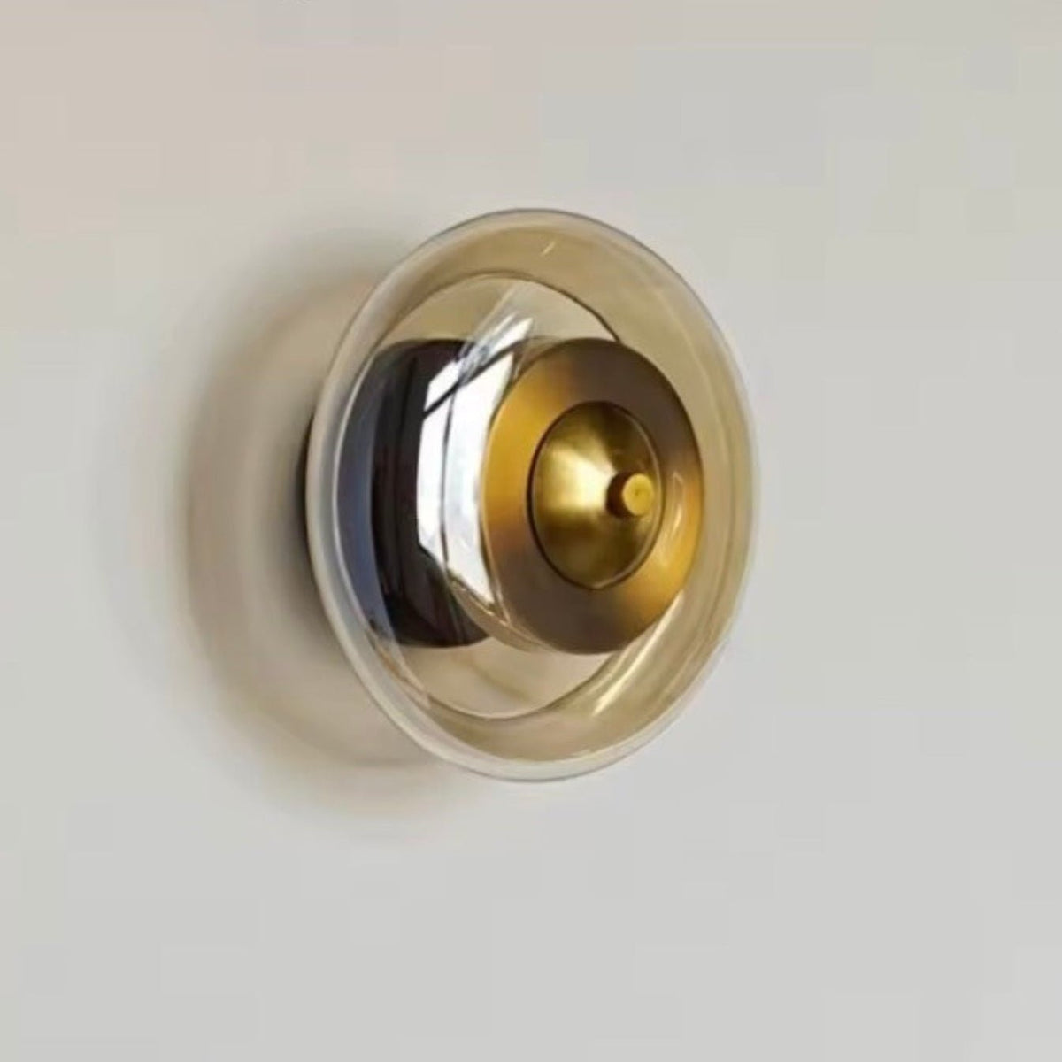 Wall lamp featuring integrated LED technology and elegant amber glass, designed for compact decorative lighting in modern interiors. 5