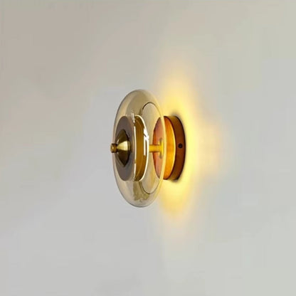 Wall lamp featuring integrated LED technology and elegant amber glass, designed for compact decorative lighting in modern interiors. 4