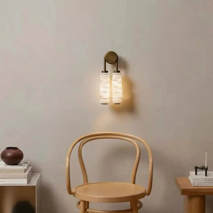 Wall lamp featuring elegant ribbed marble shades and a vintage antique metal frame, designed with a dual-light setup for a stylish and warm ambiance. 5